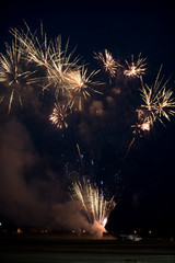 Multiple golden fireworks