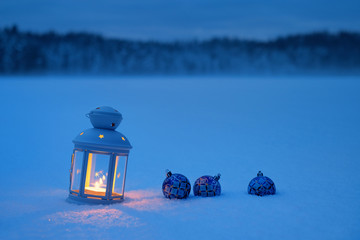 Christmas lantern with toys in the forest with fog