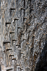 Stone shadows on a hydro electricity power plant stone dam wall