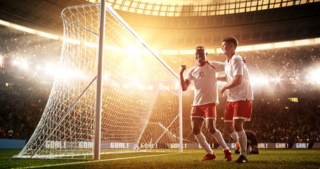 Intense soccer moment in front of the goal on the professional soccer stadium.