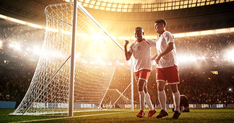 Intense soccer moment in front of the goal on the professional soccer stadium.
