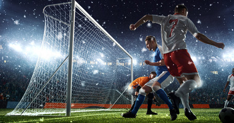 Fototapeta premium Intense soccer moment in front of the goal on the professional soccer stadium.