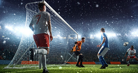 Intense soccer moment in front of the goal on the professional soccer stadium.