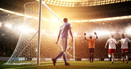 Intense soccer moment in front of the goal on the professional soccer stadium.
