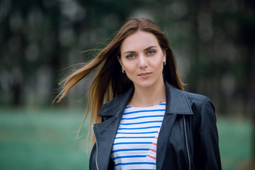Fototapeta premium modern woman on a blurred background of the Park