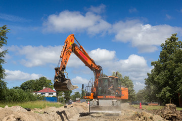 Fototapeta na wymiar excavator work on construction site, street reconstruction