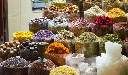 Dubai  spice market showing spices in transparent big bags in artificaly lit condition