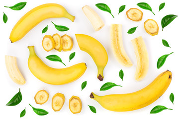 whole and sliced bananas decorated with green leaves isolated on white background. Top view. Flat lay