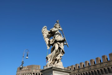 Fototapeta na wymiar Sculptures at Angel Bridge at Mausoleo di Adriano in Rome, Italy 