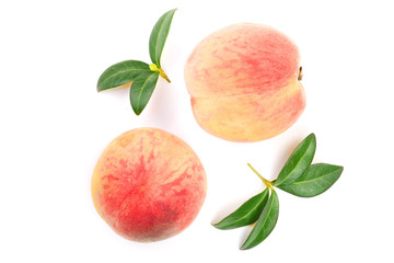 ripe peaches with leaves isolated on white background. Top view. Flat lay pattern