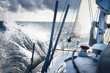 Stormy weather on the sea. A view from the sailboat's deck to the bow, Norway