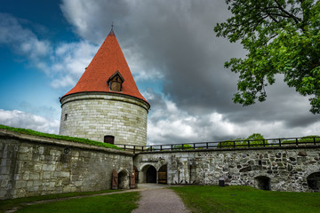 Fototapeta na wymiar DDrone Aerial image of defence towers of Kuressaare Fortress with weather vane. Spring. Medieval fortification in Saaremaa island, Estonia, Europe