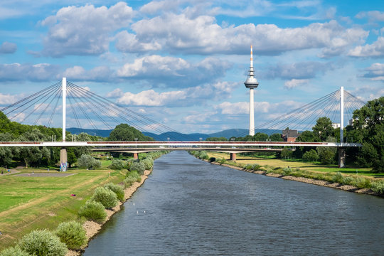 The view of Neckar river, the bridge and TV tower with hills in the background. Shot in Manheim on a sunny summer day.