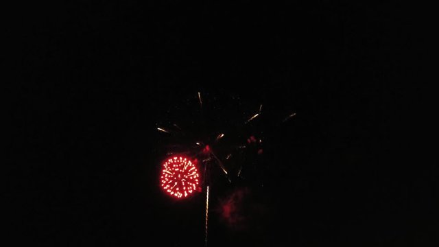 Aerial footage of fireworks over water. Rhine, Hesse, Germany.