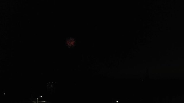 Aerial footage of fireworks over water. Rhine, Hesse, Germany.
