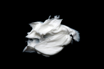 white cream on a black background