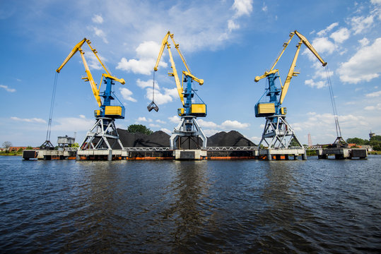 A view of the port cranes against blue sky. Riga, Latvia