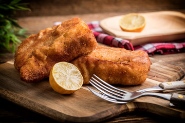 Two fried cod fillet pieces.