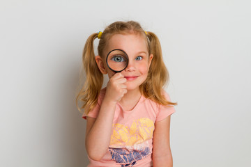 child with magnifier