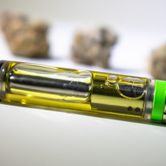 Close up on a THC extracted oil in vape pen cartridge