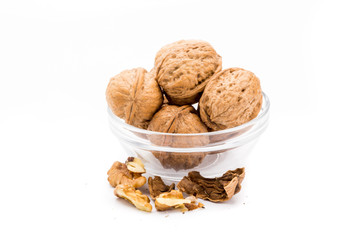 Container with large nuts isolated on a white background