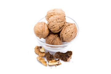 Container with large nuts isolated on a white background