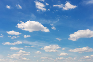 Fototapeta premium Vibrant blue sky with white clouds. Beautiful nature background