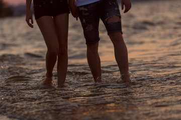 couple walks along the seacoast.
man and woman walk along the waterfront
