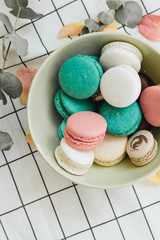 Composition of delicious macaroons in round gift box, sweet dessert
