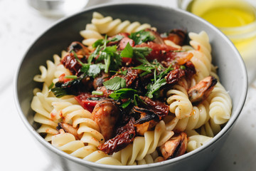 Delicious pasta with tomatoes, mussels and herbs