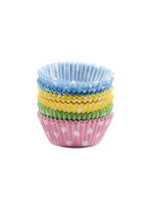 Paper cupcake holders on white background