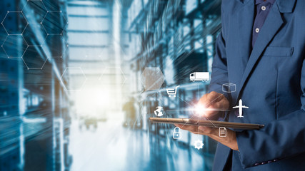 Business Logistics concept, Businessman manager using tablet check and control for workers with...