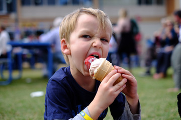 Young boy eating a famous Strawberry Sundae Ice Cream at the Ekka (Brisbane Exhibition / Royal Queensland Show)