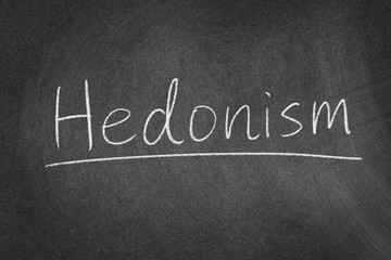 Obraz premium Hedonism concept word on a blackboard background