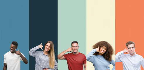 Group of people over vintage colors background smiling doing phone gesture with hand and fingers...