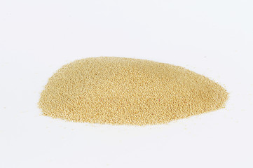 Heap of raw Quinoa seeds on white background