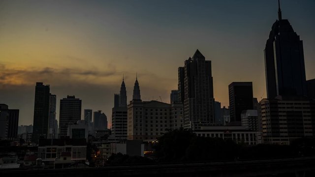 4K. Timelapse of Kuala Lumpur city skyline during beautiful sunset