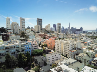 Aerial view typical Victorian residential houses in San Francisco and skylines in background....