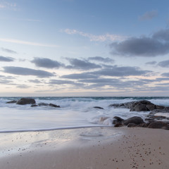 Fototapeta na wymiar sunrise over the beach with waves crashing at Yorke Peninsula, South Australia
