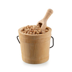 Soybeans in wooden bucket isolated on a white background