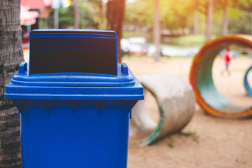 The blue bin is a non-recyclable waste bin, such as a foam plastic bag.