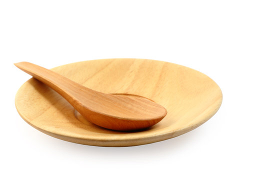 Wooden plate and tablespoon isolated clipping path.