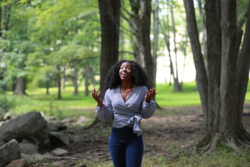 Stunned black woman looking up in amazement