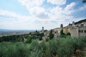 Fototapeta na wymiar Assisi,Italy-July 28, 2018: View from Santa Chiara street, Assisi 