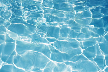 Texture of water in swimming pool for background