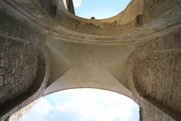 Assisi,Italy-July 28, 2018: Gate in Borgo Aretino street, Assisi 