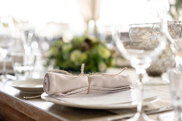 Wedding Banquet or gala dinner. The chairs and table for guests, served with cutlery and crockery. Covered with a linen tablecloth runner. party on terrace