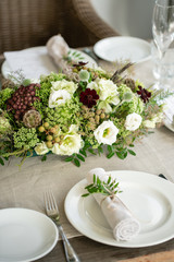 Wedding Banquet or gala dinner. The chairs and table for guests, served with cutlery and crockery. Covered with a linen tablecloth runner. party on terrace