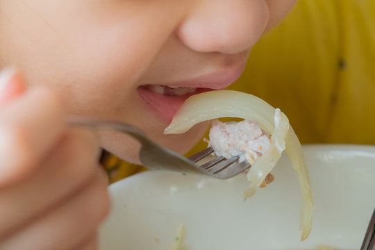 Teenage Girl Putting Food In Her Mouth