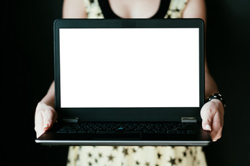 e-commerce and e-business. online digital marketing. make money on the internet. woman holding laptop with empty white screen.